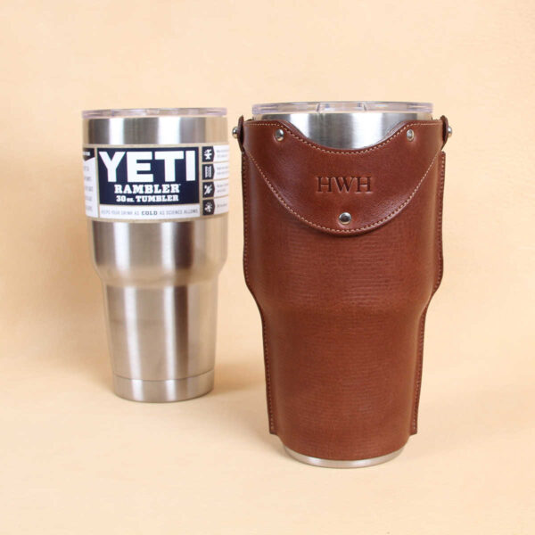 Leather tumbler sleeve for 30 ounce Yeti Rambler cup stainless steel and brown sleeve front.