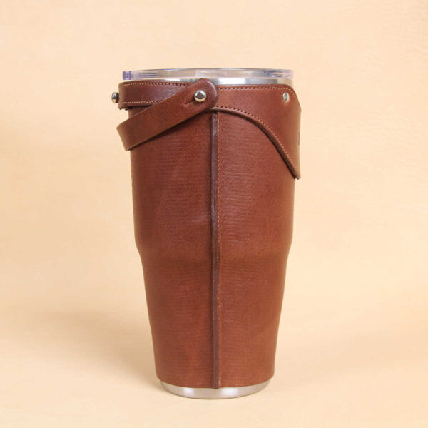 Leather tumbler sleeve for 30 ounce Yeti Rambler cup brown sleeve side vertical stitching.