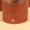 brown leather glass sleeve with initial emboss