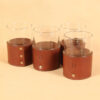 brown leather sleeve holding veranda glass