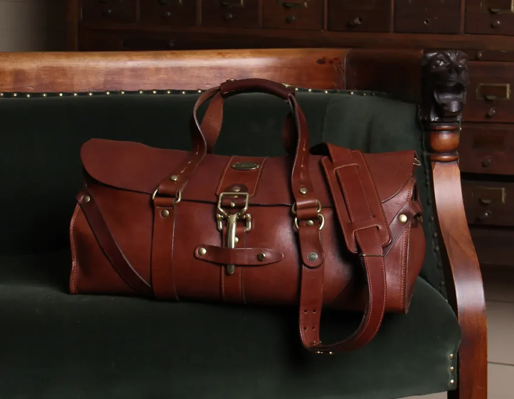 10 Reasons To Tell Your Wife Why You Bought A New Col. Littleton Bag 21 No 1 grip sitting on a velvet couch