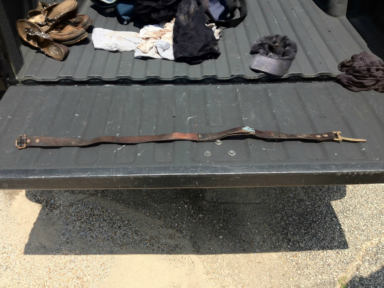 Worn and moldy No. 5 Cinch Belt, laid out on truck