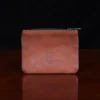 no1 brown leather small zip it bag - back view - on wooden table
