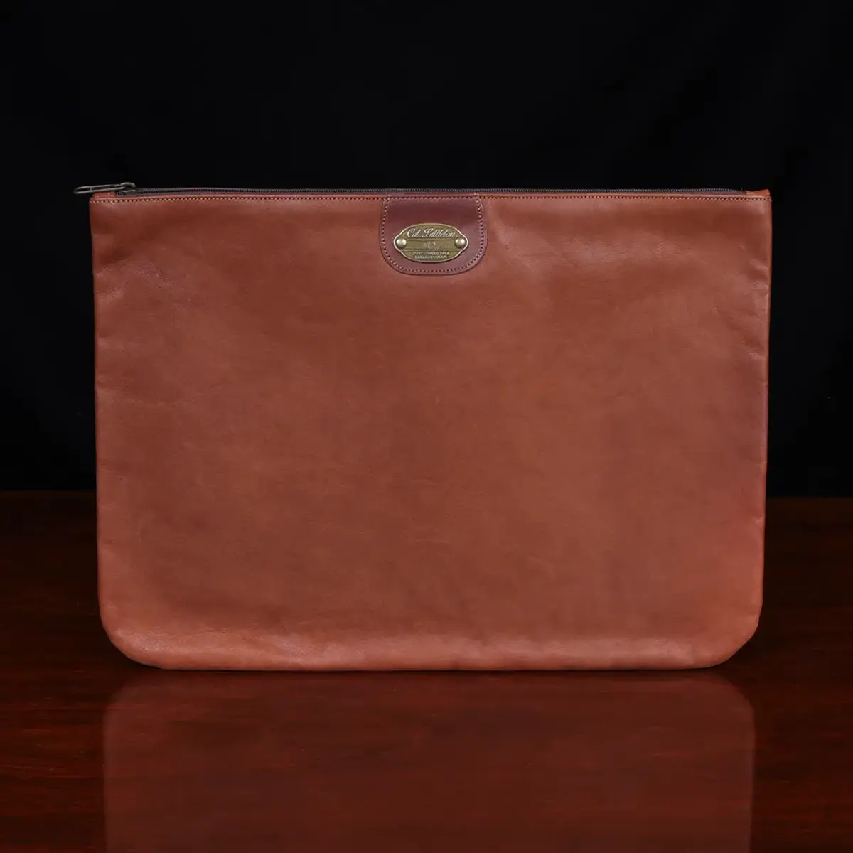 no3 brown leather large zip it bag - front view - on wooden table