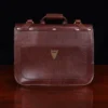 commander leather laptop briefcase on a wooden table with a dark background - back view no strap