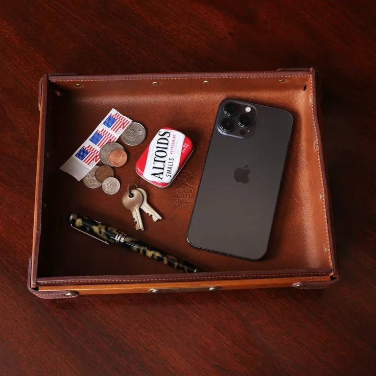 No. 120 Valet Tray on wooden table holding phone, keys, mints, stamps, change, and pen