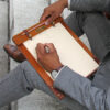 man sitting on stairs using the medium no. 9 writing board