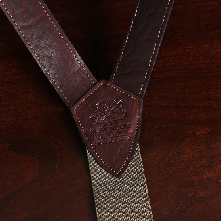closeup view tobacco brown american buffalo leather suspenders and brass hardware