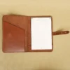 front view of the colonel littleton private stock journal with a rugged leather