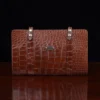 No.18 legal portfolio in alligator front horizontal view - id 001- on wooden table with black background