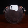 Bitsy Belt Bag in dark Tobacco Brown American Buffalo - back view of pocket with white iPhone