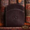 tobacco american buffalo leather front pocket wallet with initial personalization in front of vintage books