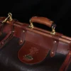 Dark brown buffalo leather No. 3 grip travel bag handle close-up