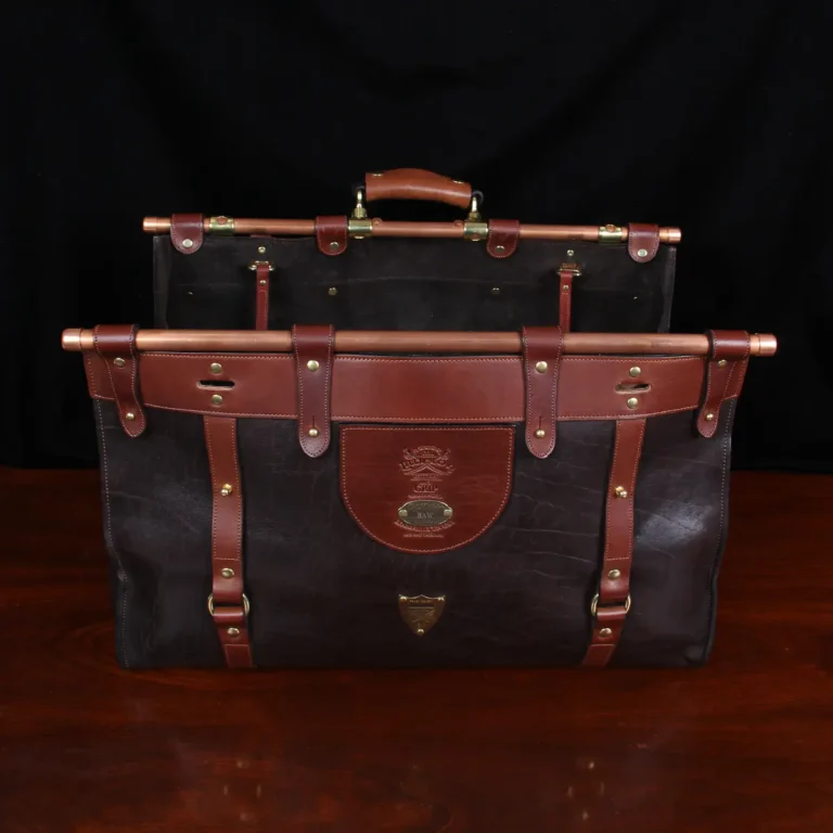Open front view of Dark brown buffalo leather No. 3 grip travel bag sitting on table