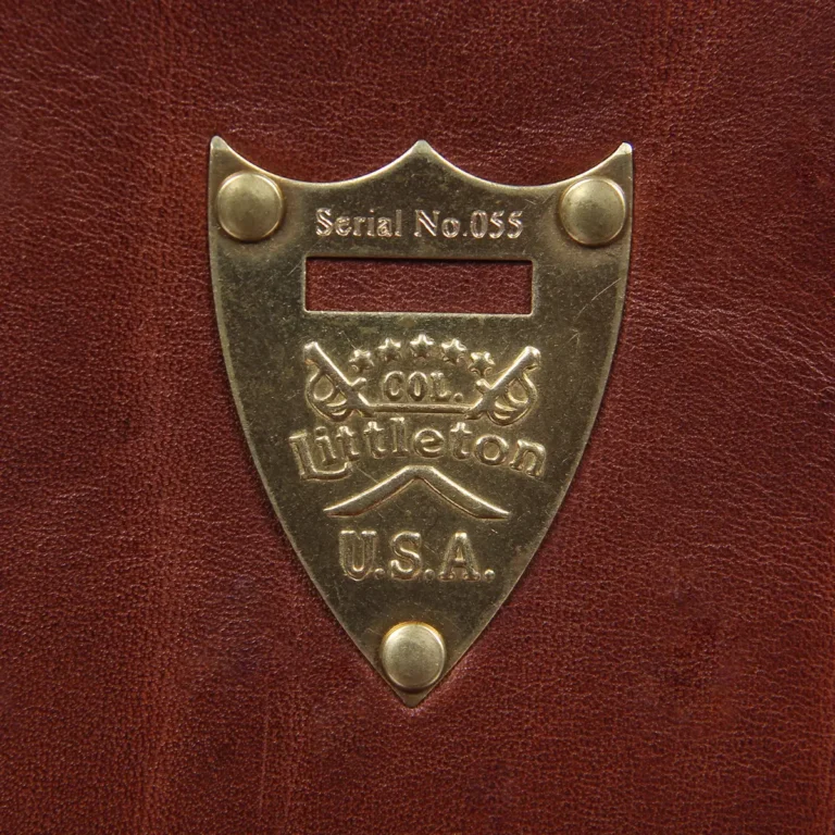 Tobacco Brown American Buffalo No. 1 Saddlebag Briefcase - Detail view of serial number engraved pommel shield