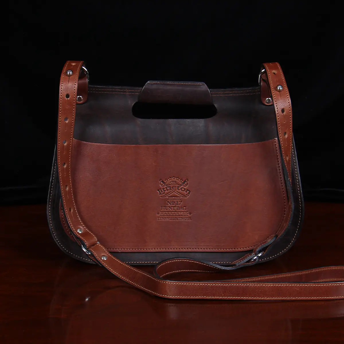 back of No. 17 Hunt Bag made of two-tone brown American Buffalo and Vintage Brown Steerhide leather with logo stamp