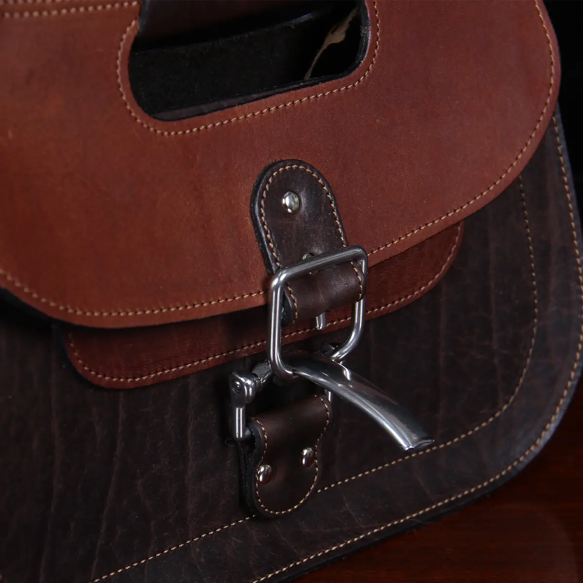 close up of latch on No. 17 Hunt Bag made of two-tone brown American Buffalo and Vintage Brown Steerhide leather