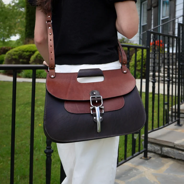 no 18 leather huntbag in tobacco buffalo - front view - worn on a woman