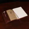 open composition journal notebook preview with a pencil and refill journal