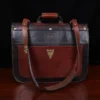 Dark brown American buffalo leather vintage-style No. 41 Commander Briefcase on wood table - back view