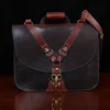 Dark brown American buffalo leather vintage-style No. 41 Commander Briefcase on wood table - front view