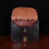 Dark brown American buffalo leather vintage-style No. 41 Commander Briefcase on wood table - front open view
