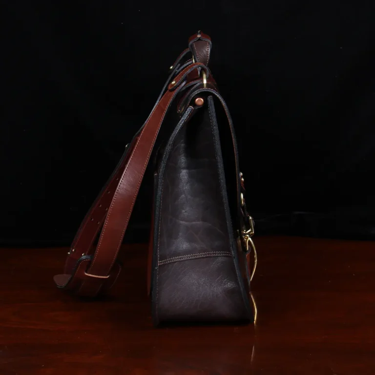 Dark brown American buffalo leather vintage-style No. 41 Commander Briefcase on wood table - side view