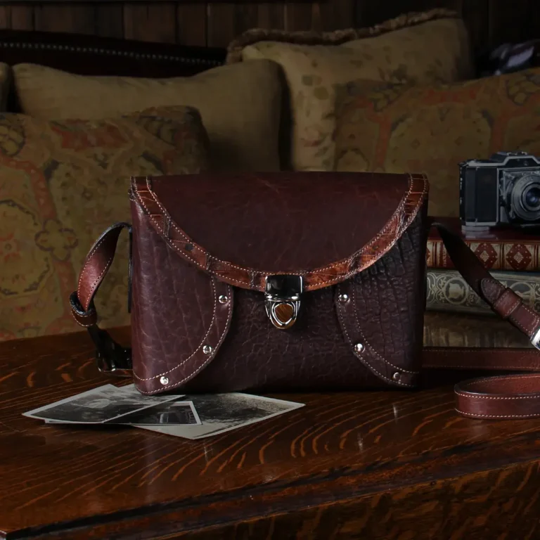 buffalo leather crossbody box bag on table