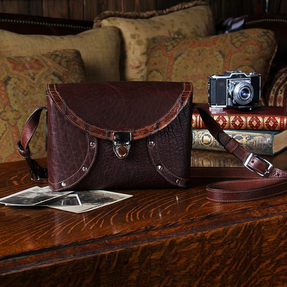 buffalo leather crossbody box bag on table