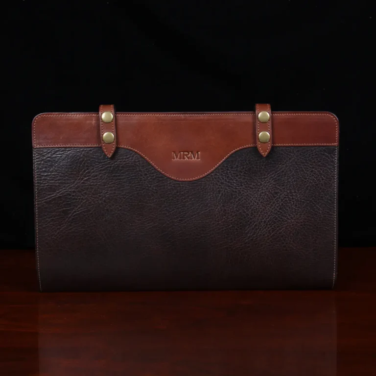 no 28 legal size leather portfolio in tobacco buffalo on a wood table - front view