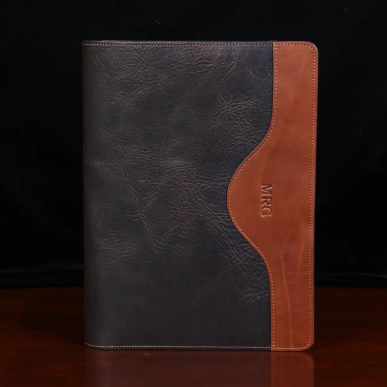 no 28 leather portfolio in tobacco buffalo - front view - on wood table with dark background