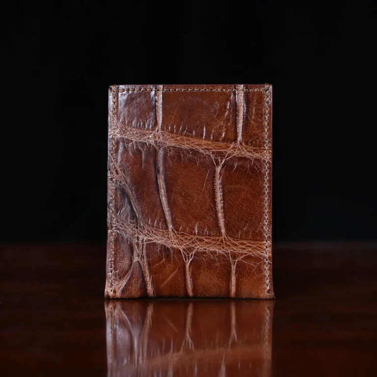 No. 4 Card Case in Vintage Brown American Alligator - ID 003 - back view on a wood table and dark background