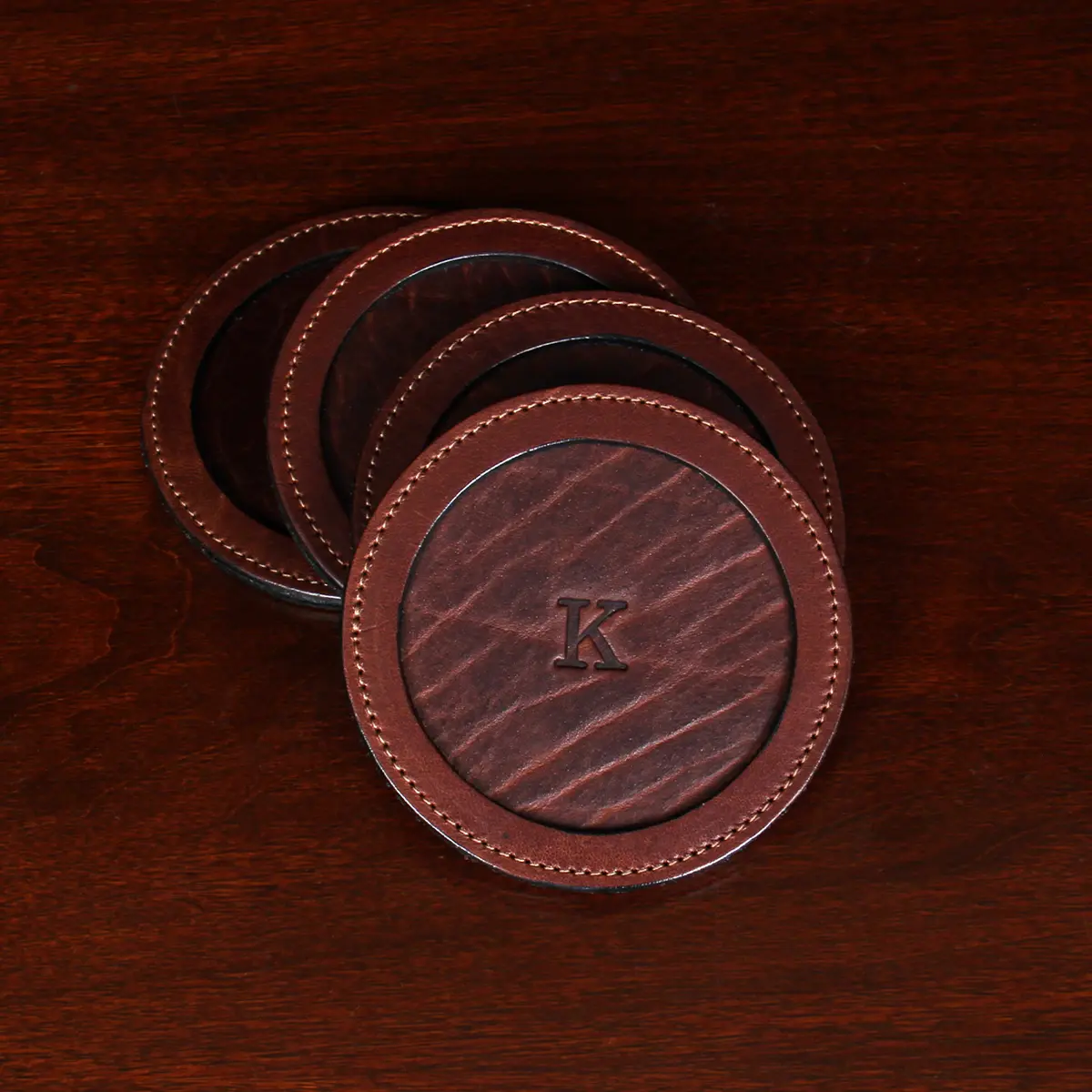 Tobacco Brown American Buffalo Leather Coasters on table stacked