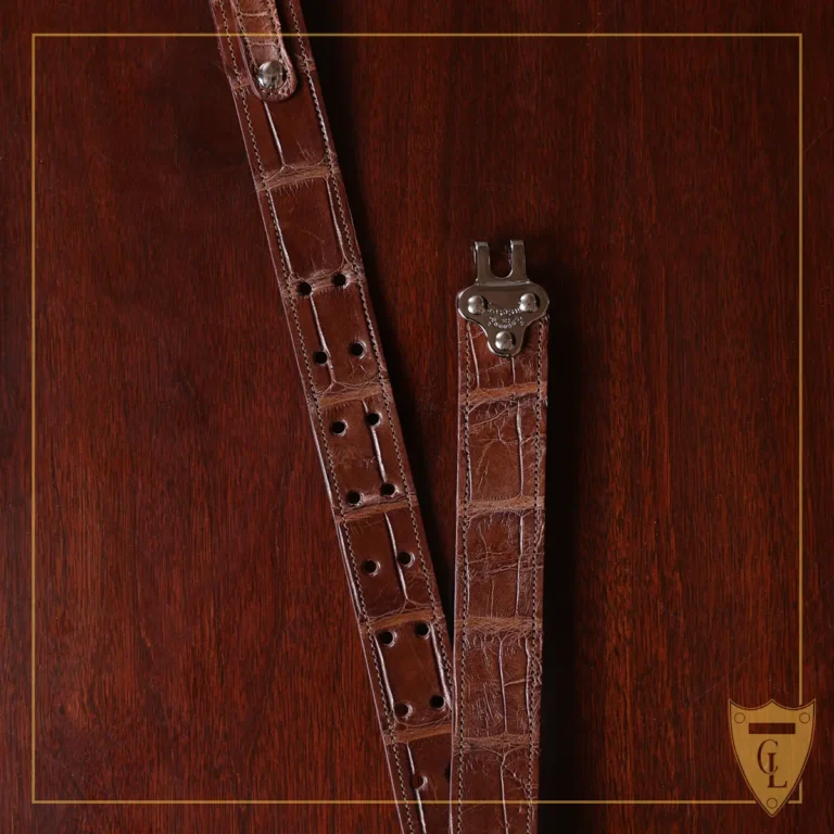 No. 5 Cinch Belt in Vintage Brown American Alligator with Nickle hardware - clasp view a black background