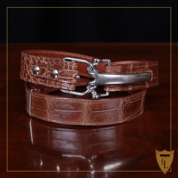 No. 5 Cinch Belt in Vintage Brown American Alligator with Nickle hardware - front view a black background