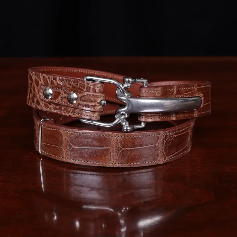 No. 5 Cinch Belt in Vintage Brown American Alligator with Nickle hardware - front view a black background