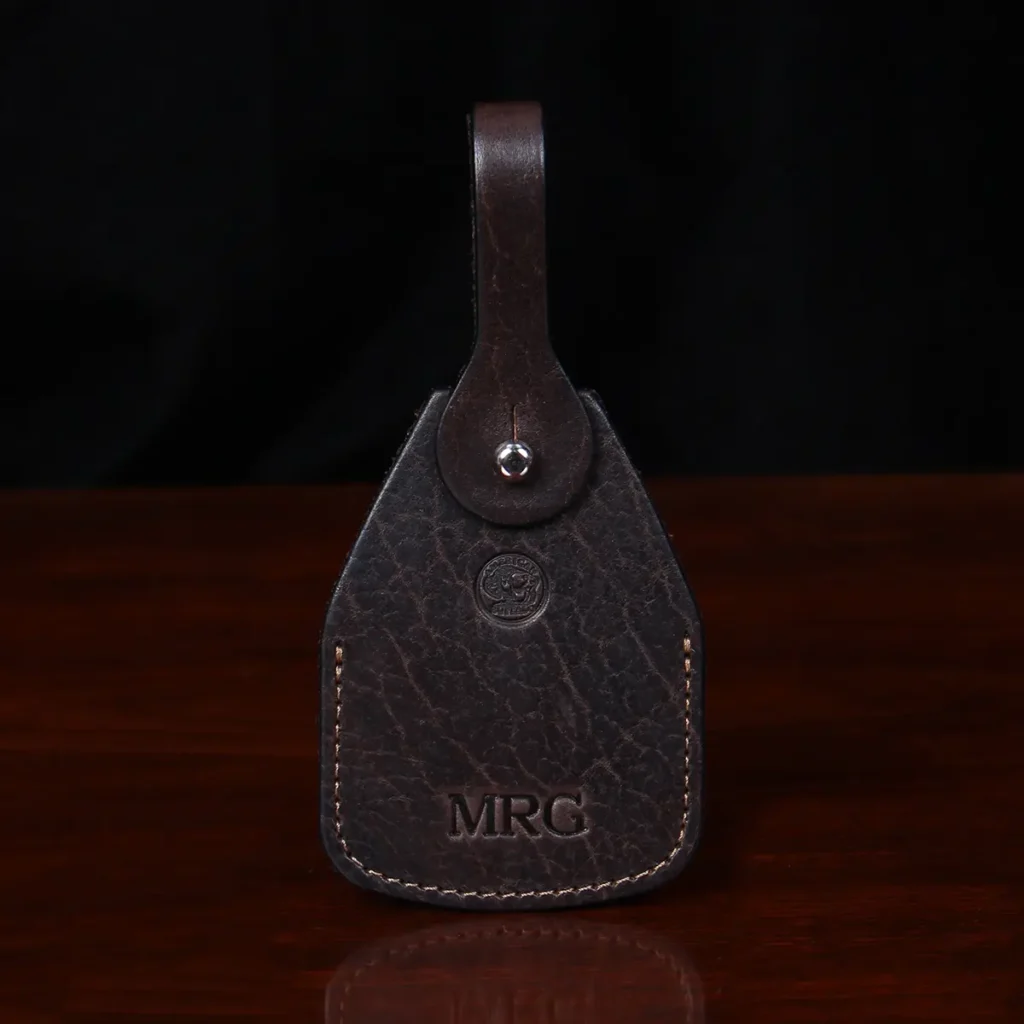 front view Tobacco Brown American Buffalo Luggage Tag on wood table with CL Buffalo