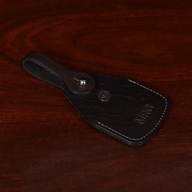 side view Tobacco Brown American Buffalo Luggage Tag on wood table with CL Buffalo