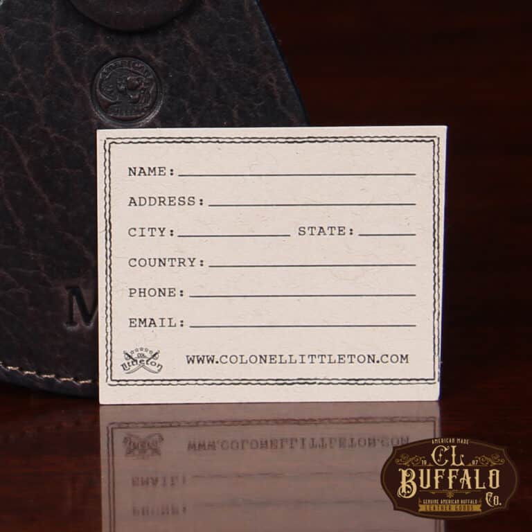 tag view of Tobacco Brown American Buffalo Luggage Tag on wood table with CL Buffalo logo in bottom right hand corner