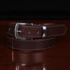 no 4 tobacco buffalo belt - coiled front view on wooden table