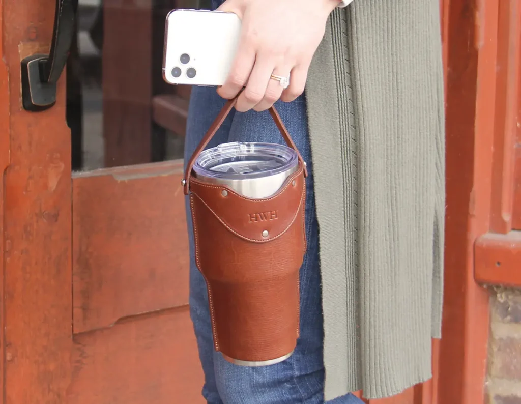 Introducing…The Traveler 24 lady holding a traveler cup