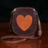 small leather purse with heart on front