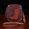small leather purse with boot on front