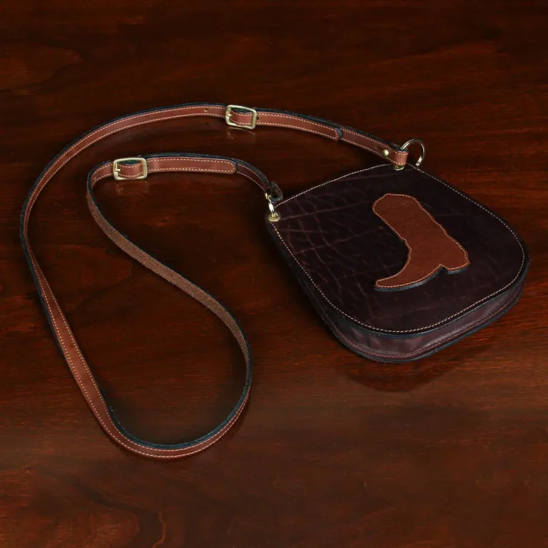 small leather purse with boot on front