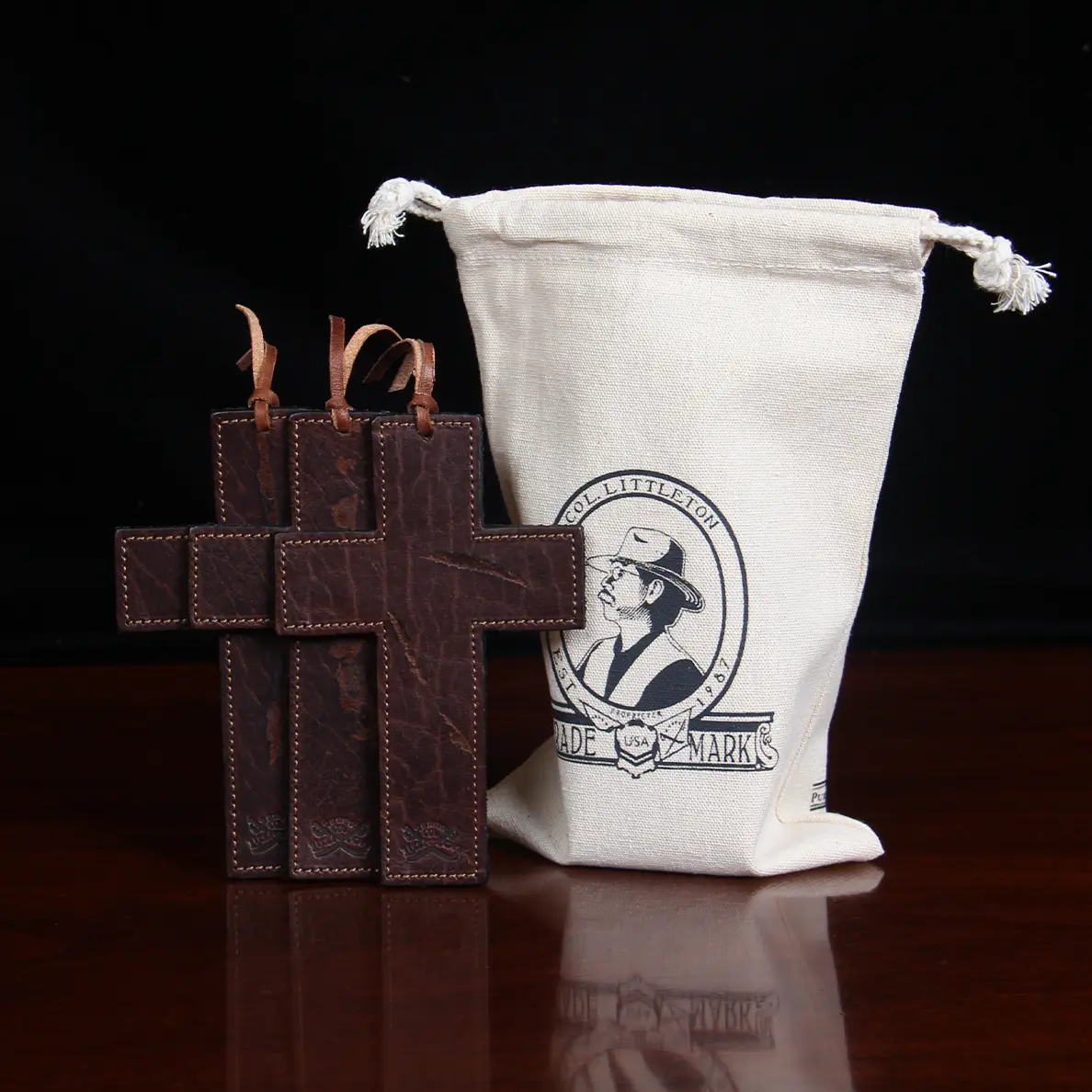 three leather cross bookmarks with cotton bag