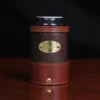 dark brown leather can coozie with soda can in it