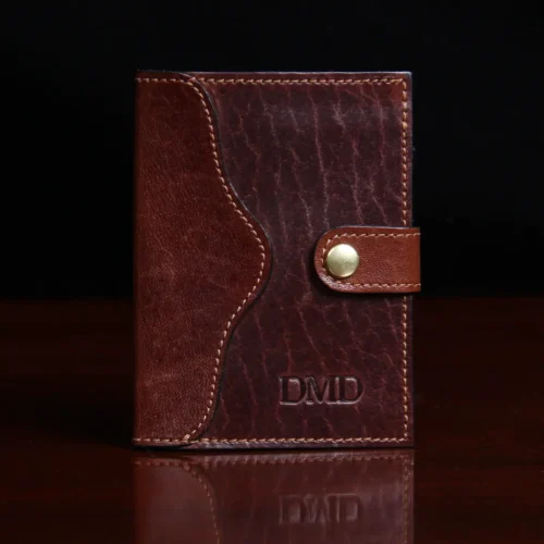 dark brown leather wallet with snap closure