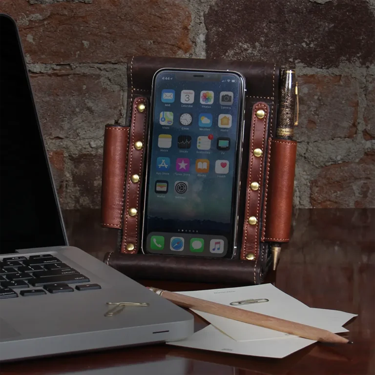 Tobacco Brown American Buffalo Phone Stand Holder with phone on desk next to laptop