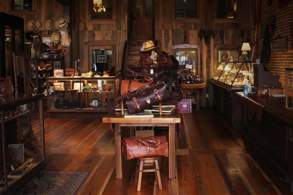Alternative view of the Inside of the Col. Littleton Retail Store, showing a collection of leather bags