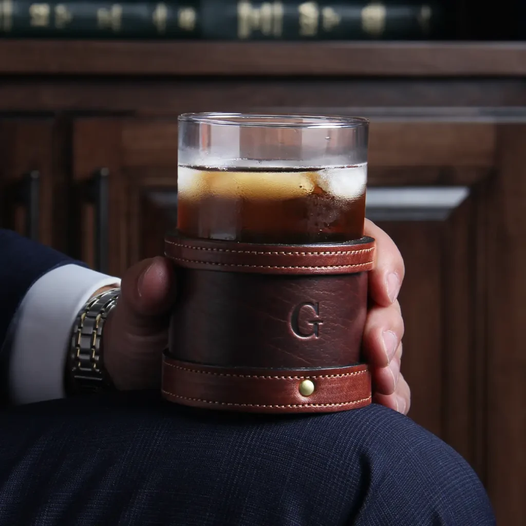 Veranda Glasses in Tobacco Brown American Buffalo with vintage brown steerhide trim - Single glass full of Sweet Tea in a man's hand